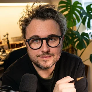 Matt, founder of Joycast, at his studio desk